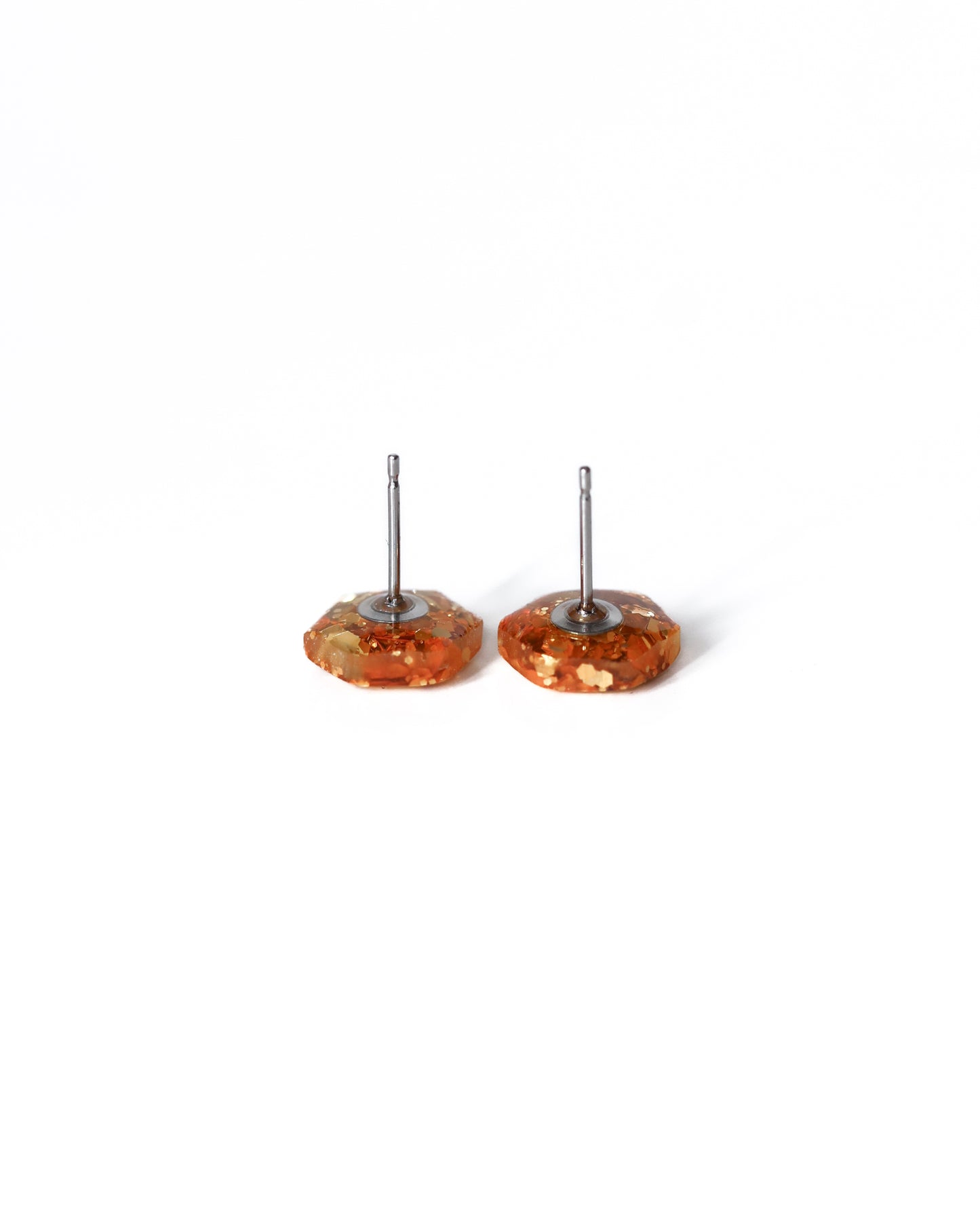 Delicate golden hexagon stud earrings with surgical hypoallergenic posts