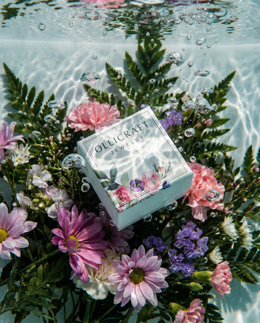 Ollijewelry jewelry box surrounded by water and flowers