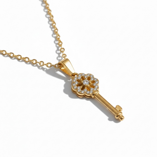 Gold key pendant necklace with sparkling crystals on a delicate chain, minimalist jewelry