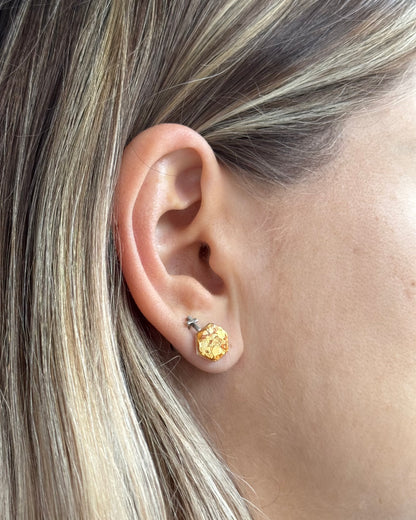 Delicate golden hexagon stud earrings with surgical hypoallergenic posts