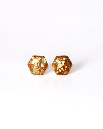 Delicate golden hexagon stud earrings with surgical hypoallergenic posts