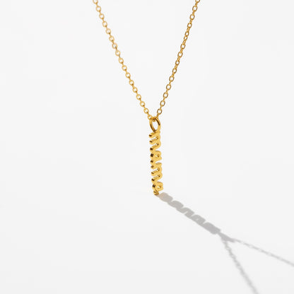 Minimalist gold necklace with vertical mama pendant on white background