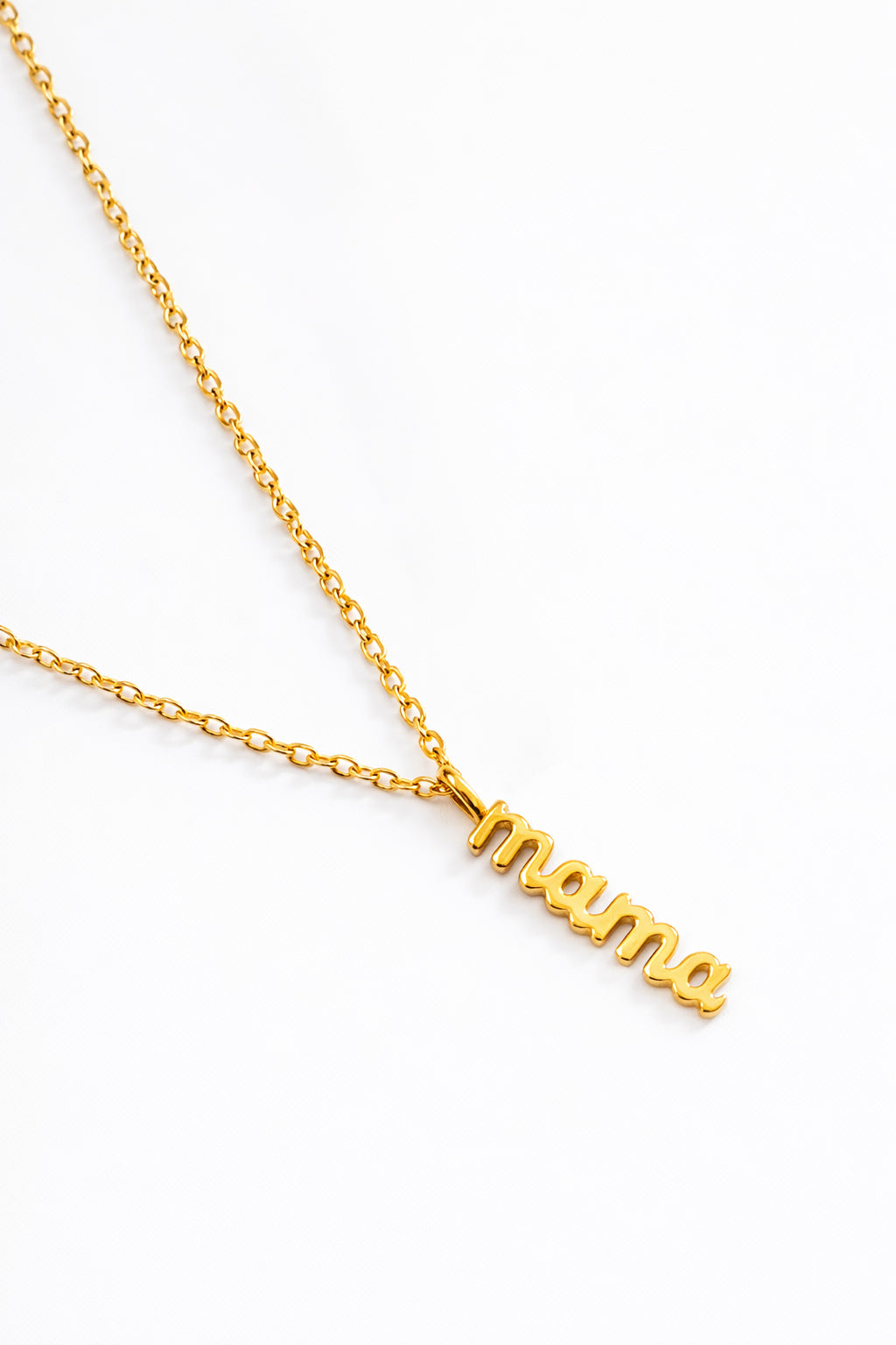 Gold chain necklace with 'mama' script pendant on white background, handmade jewelry
