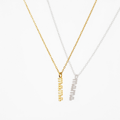 Gold necklace with vertical mama pendant on white background, minimalist jewelry