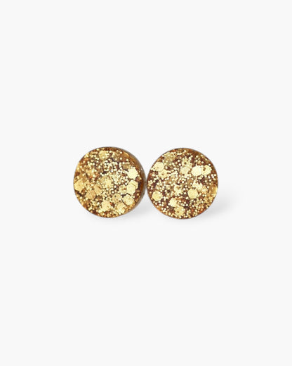 Gold round stud earrings on a white background