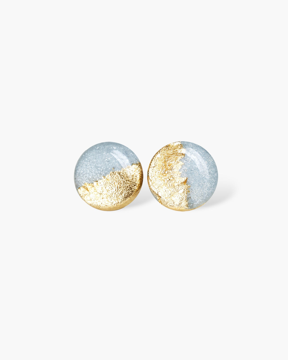 Minimalist round stud earrings with gold and silver-tone surgical steel finish on white background