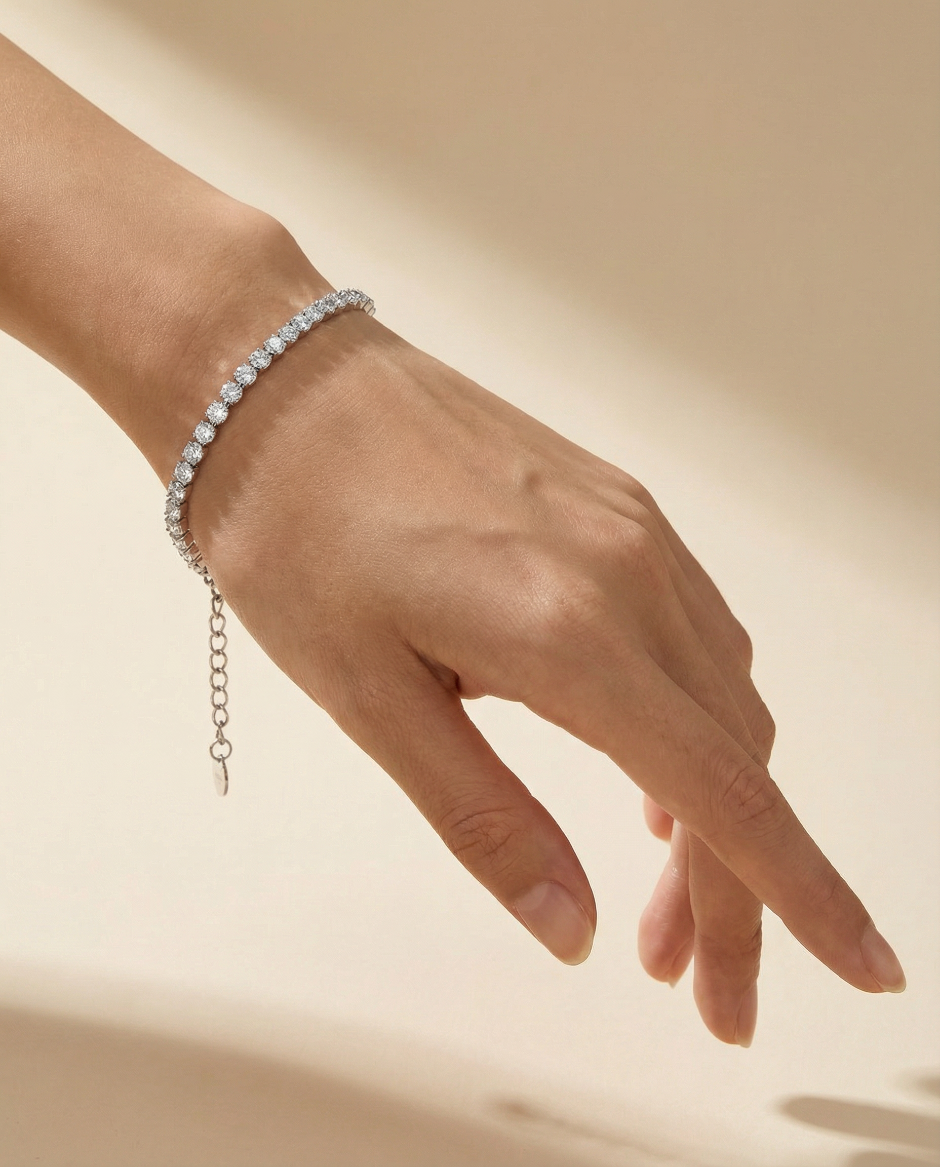 Elegant zirconia tennis bracelet in 925 sterling silver on wrist, minimalist jewelry