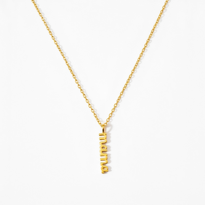Gold minimalist necklace with vertical 'mama' pendant on white background
