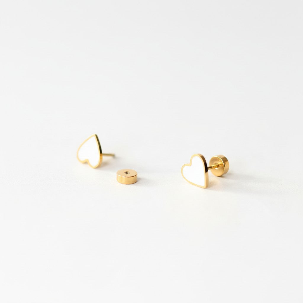 Minimalist gold heart stud earrings with flat back on white background