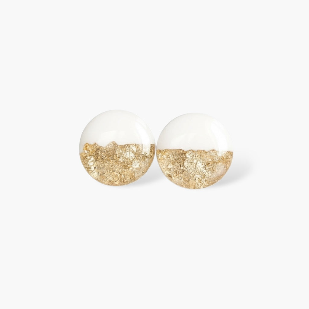 Minimalist round stud earrings with clear resin and gold foil accents on white background