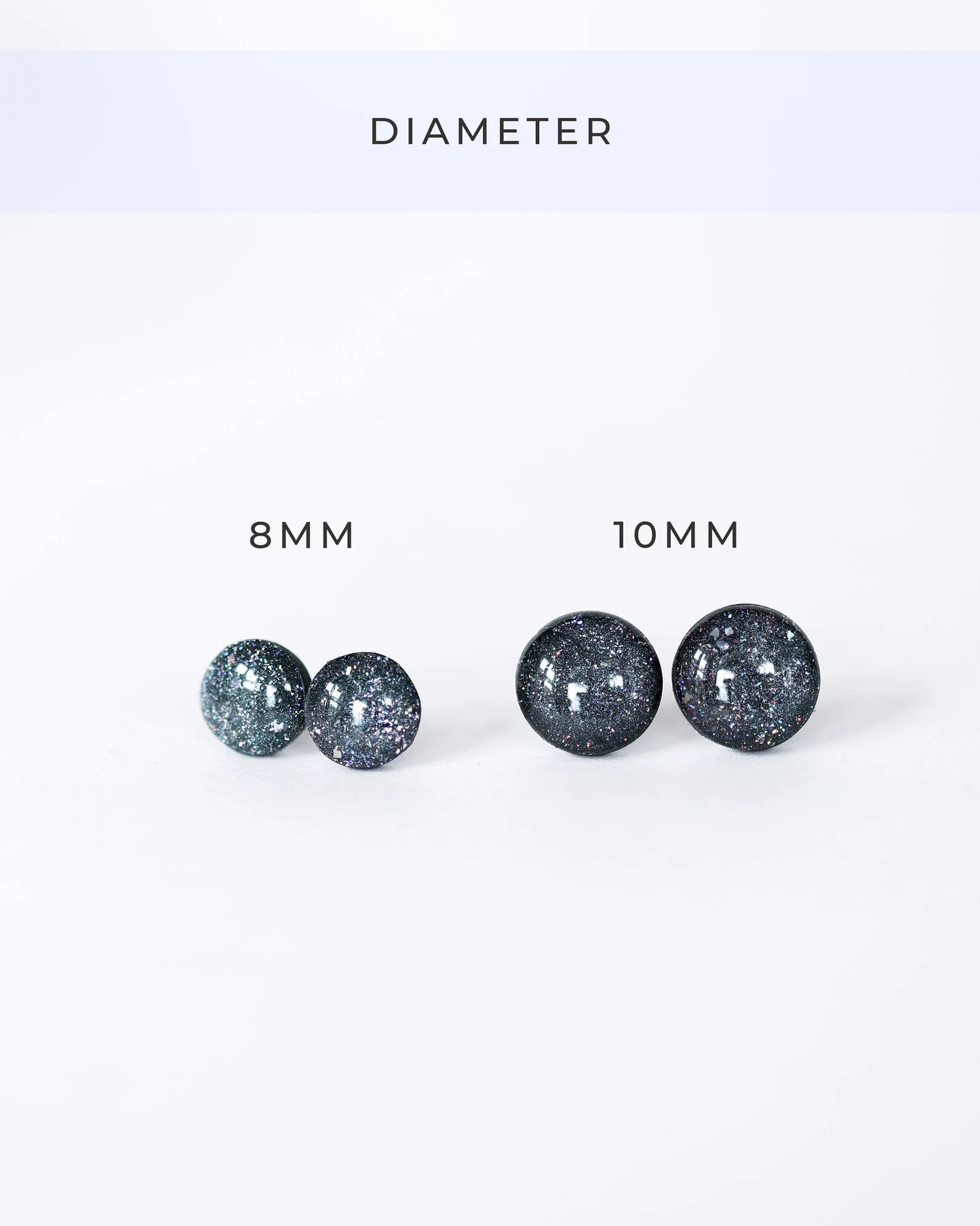 Pair of glittery earrings with '8 MM' and '10 MM' labels on a white background