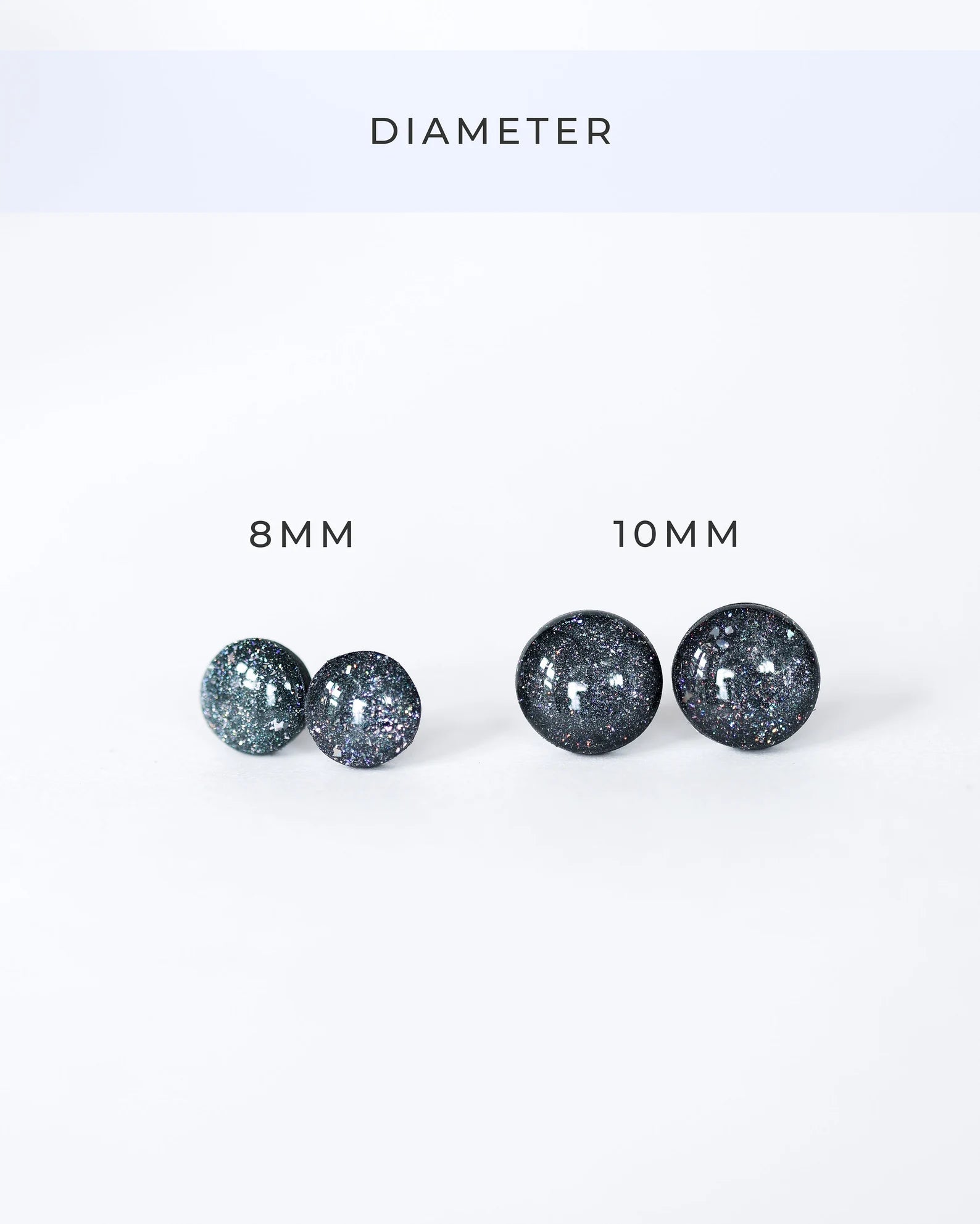 Pair of glittery earrings with '8 MM' and '10 MM' labels on a white background