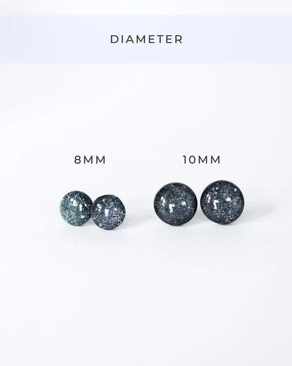 Pair of glittery earrings with '8 MM' and '10 MM' labels on a white background