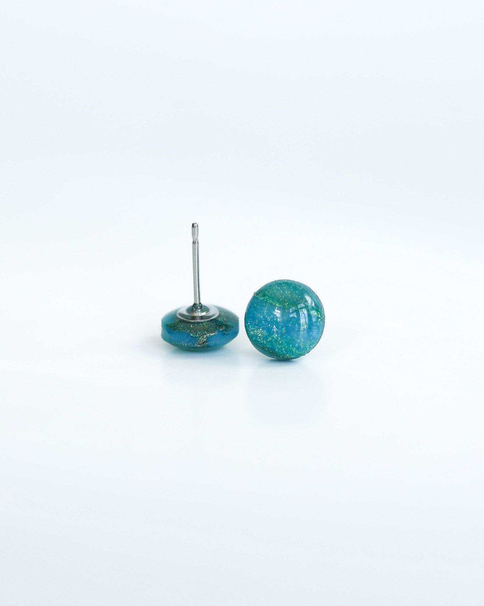 Turquoise ceramic earrings on a white background