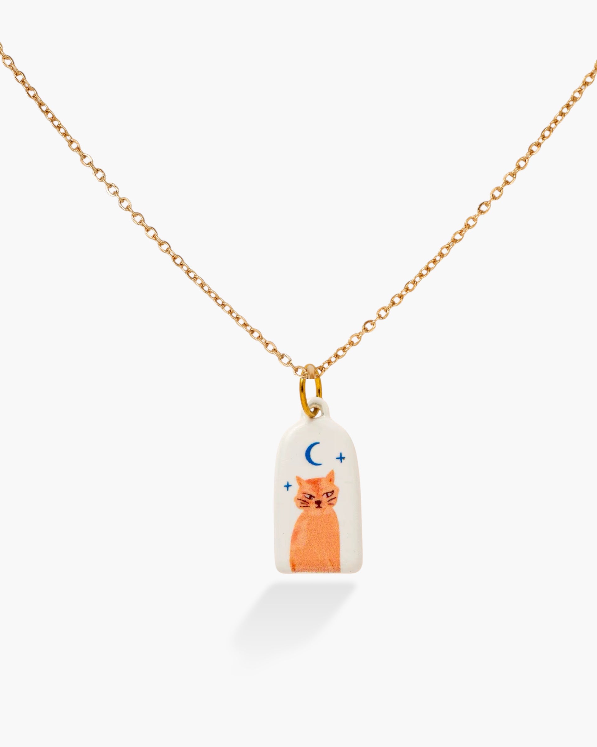 Necklace with a pendant featuring a cat design on a white background
