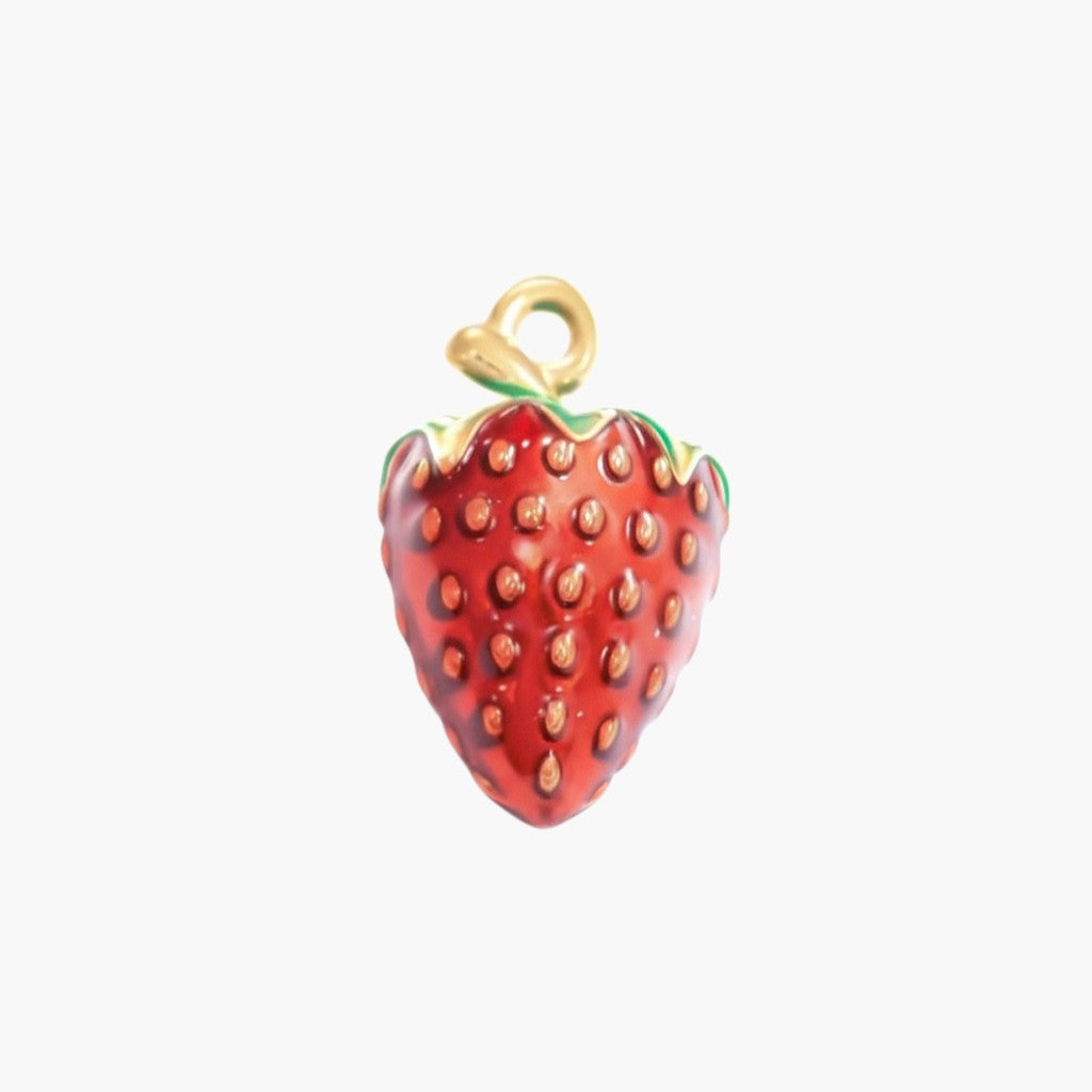 red enamel strawberry charm pendant with gold loop on white background