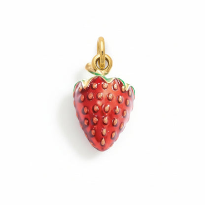 Handmade gold and enamel strawberry charm pendant with red berry design on white background