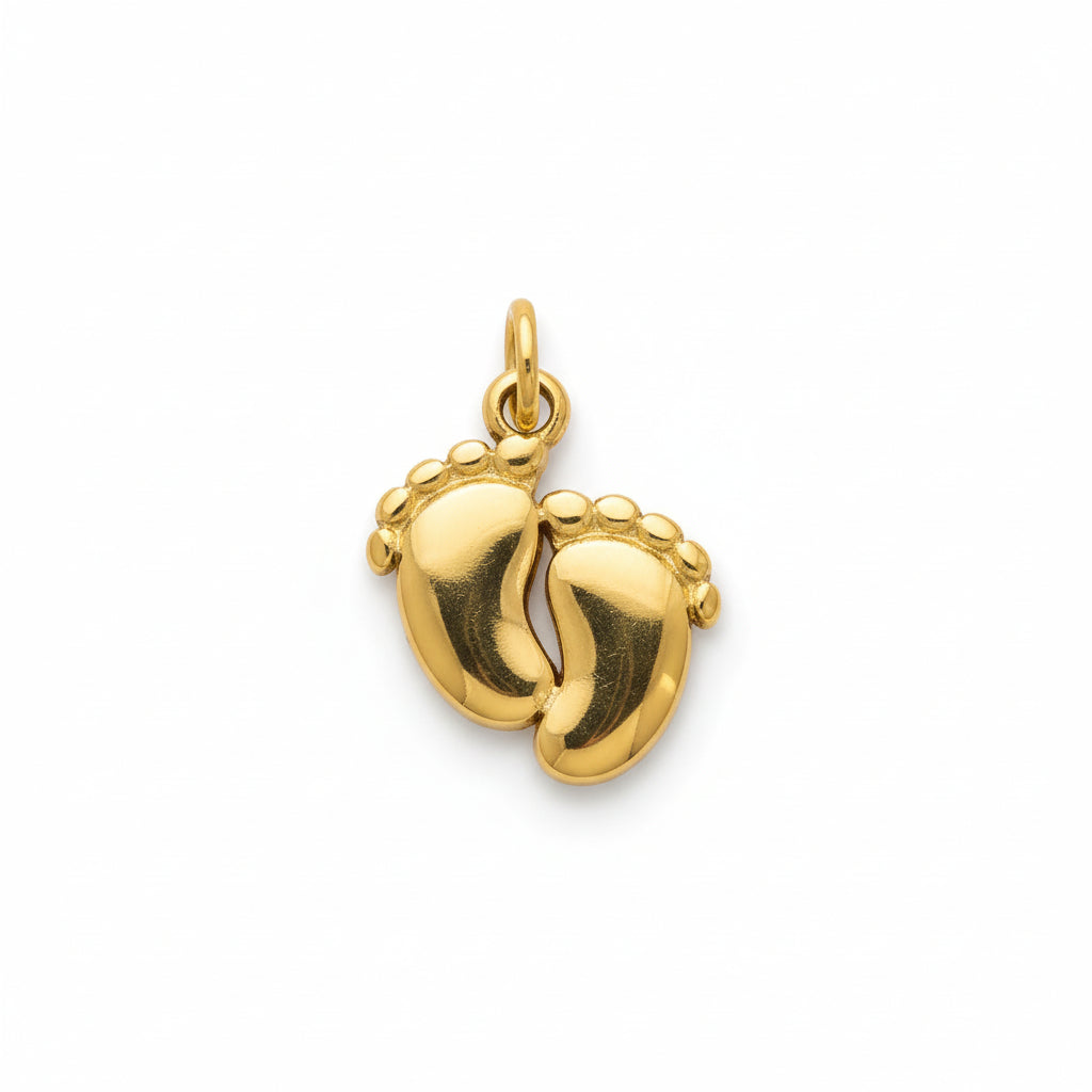 Gold minimalist baby feet pendant charm on white background