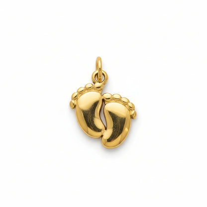 Gold minimalist baby feet pendant charm on white background
