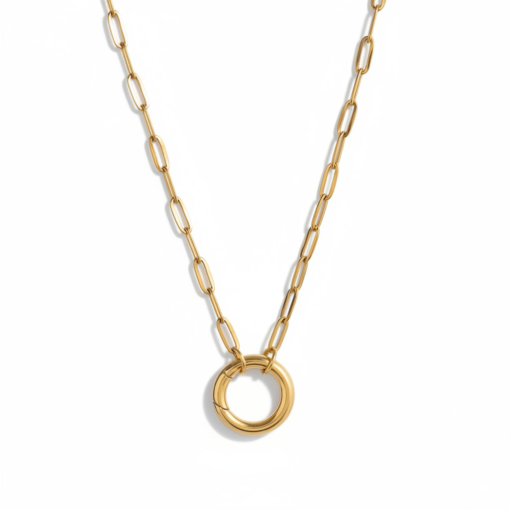 Minimalist gold chain necklace with circular pendant on white background