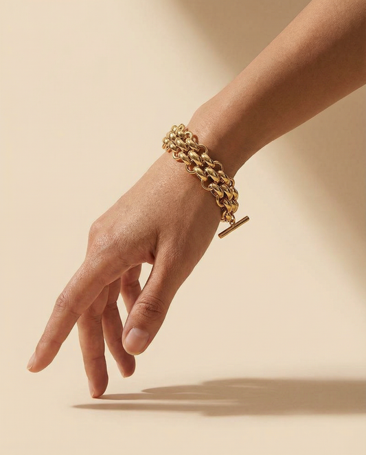 gold plated chunky toggle link chain bracelet on wrist, minimalist jewelry style