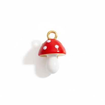 Red and white enamel mushroom charm pendant with gold loop on a white background