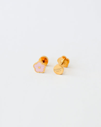 Ollijewelry gold-toned stainless steel flower stud earrings with pink enamel and comfortable flat back closure.