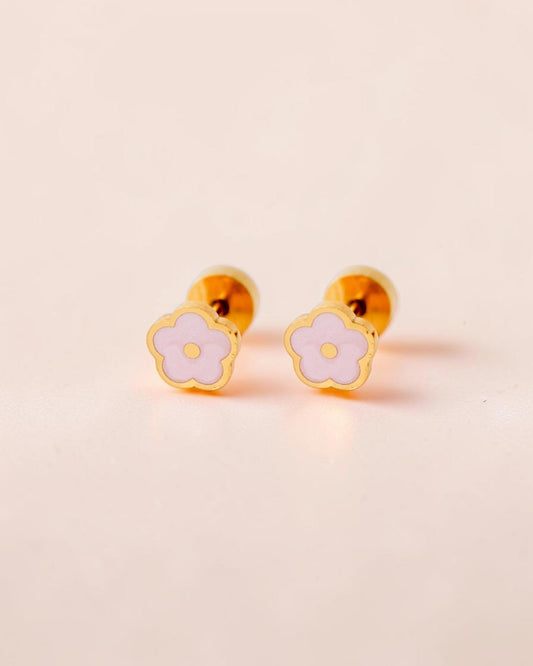 Ollijewelry pink flower flat back stud earrings in gold-toned surgical steel with enamel detailing on a soft background