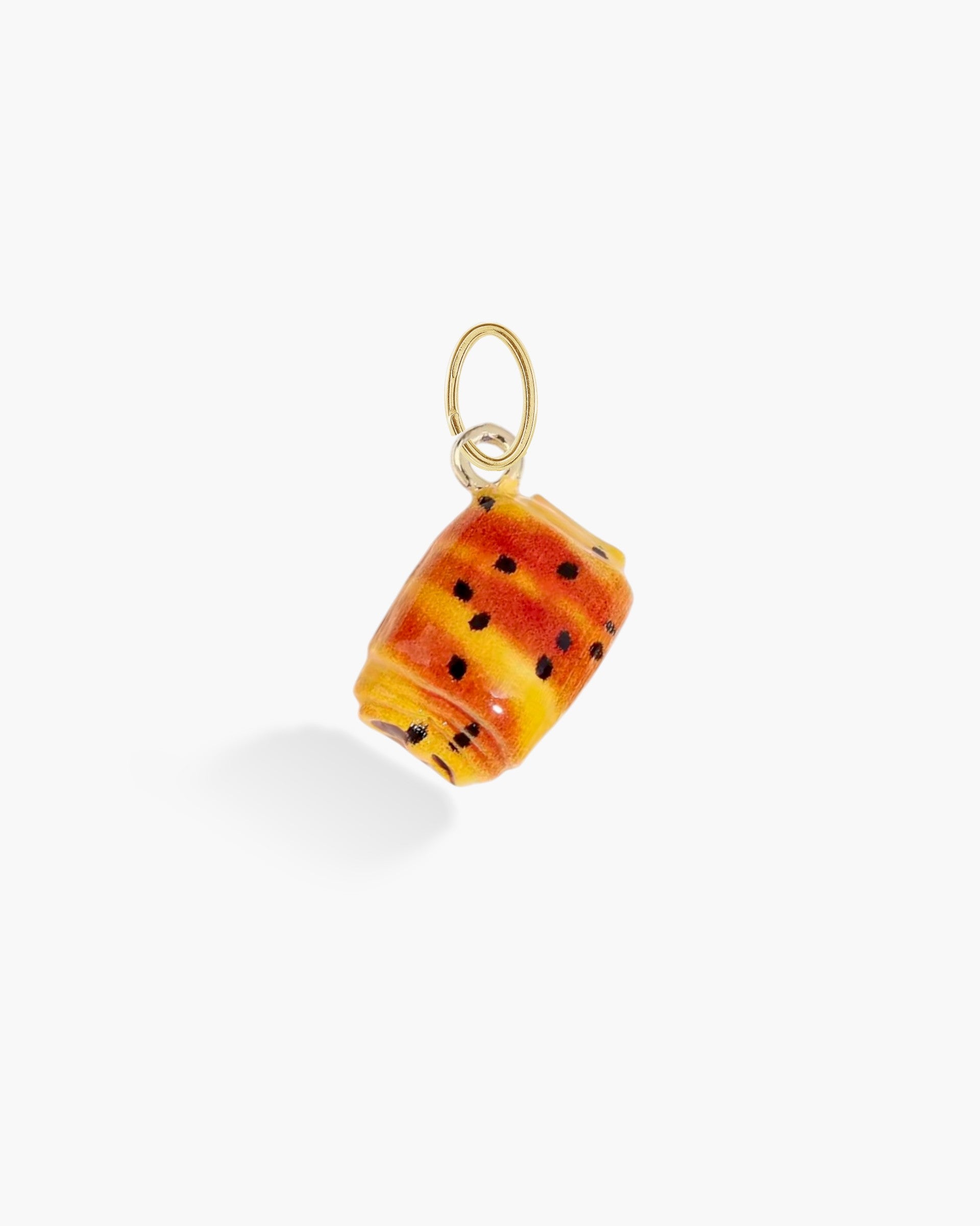 Miniature croissant pastry charm with gold loop, detailed bakery-inspired jewelry piece