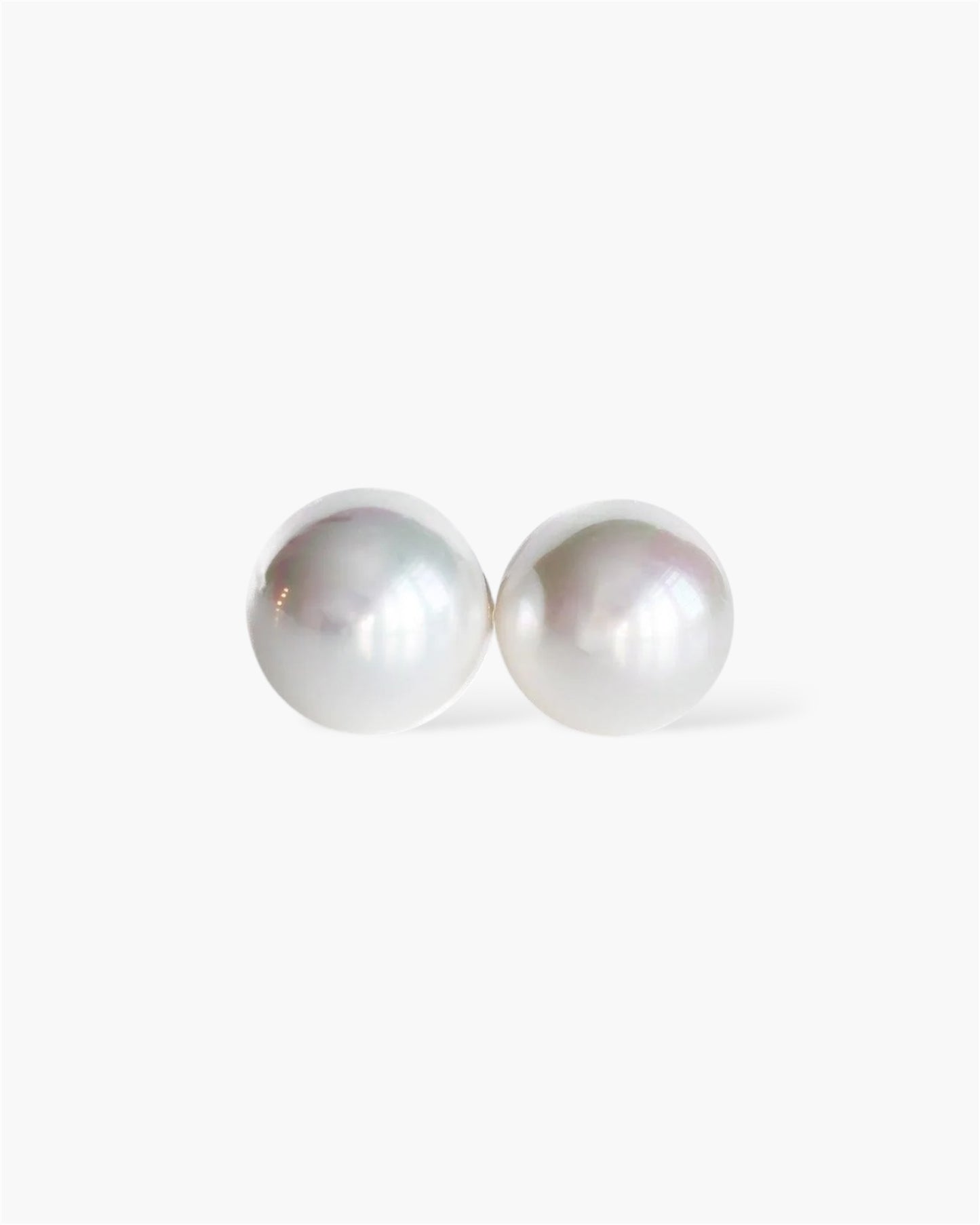 Pair of pearl earrings on a white background