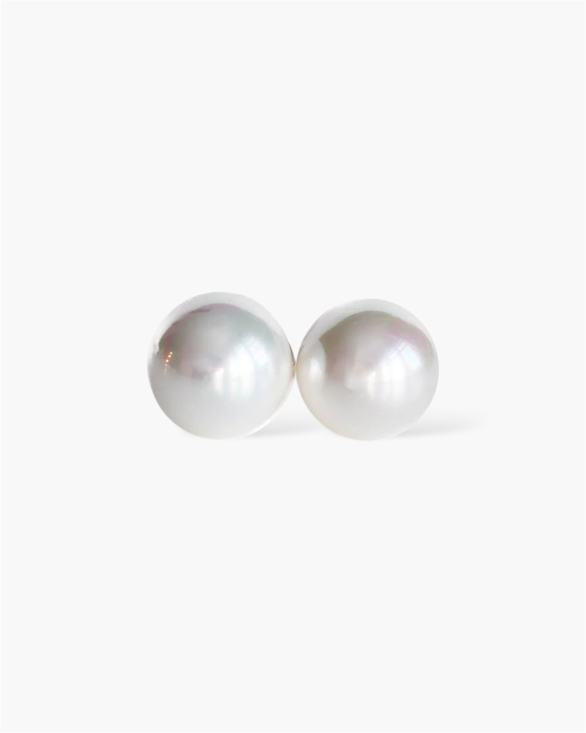 Pair of pearl earrings on a white background