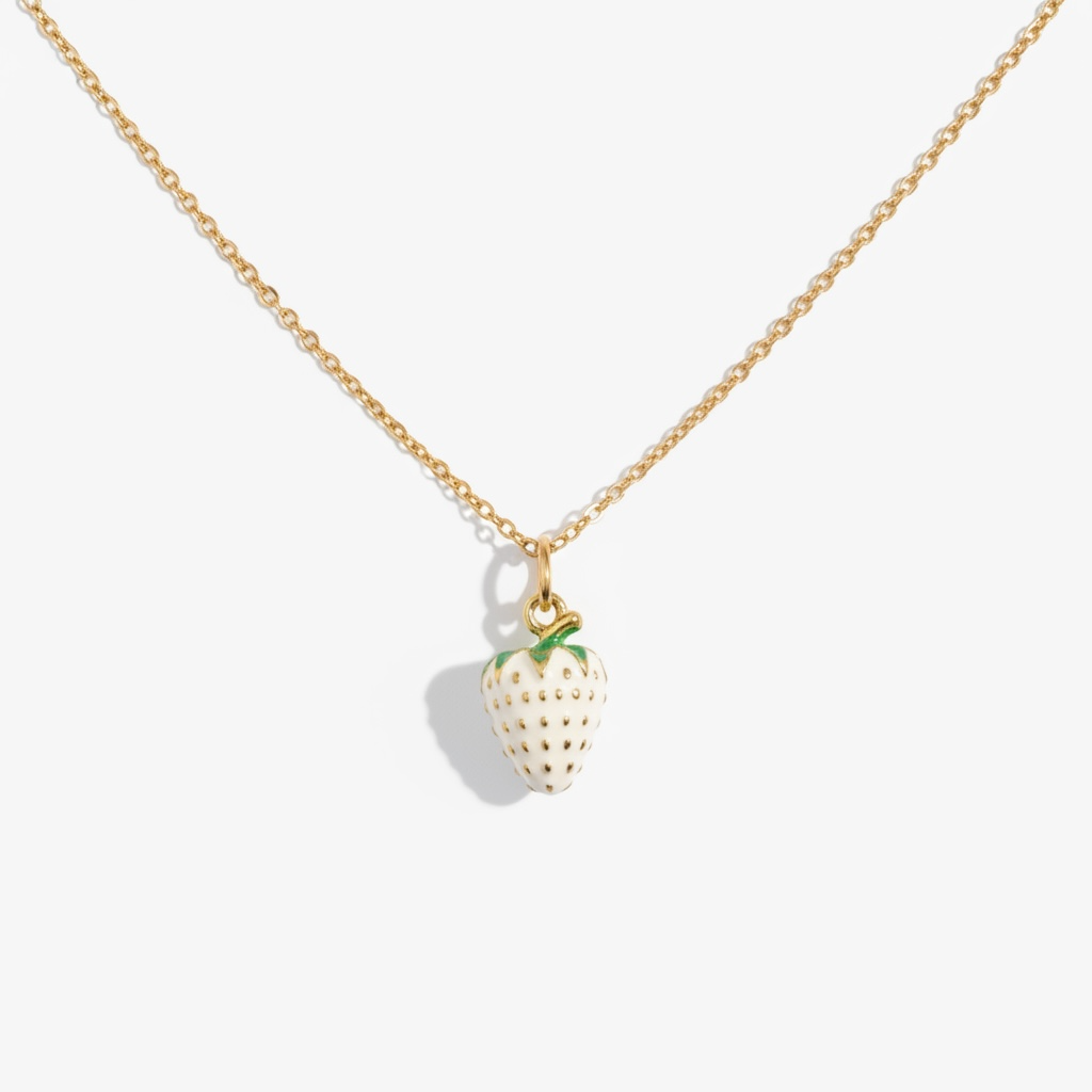 Gold necklace with a strawberry pendant on a white background