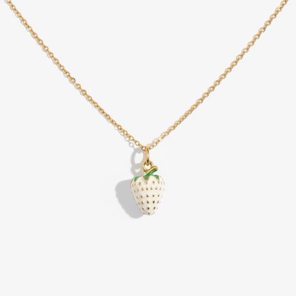 Gold necklace with a strawberry pendant on a white background